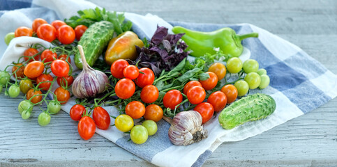 fresh ripe vegetables and kitchen towel on table. close up. organic Food background. concept of...