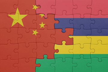 puzzle with the colourful national flag of mauritius and flag of china .