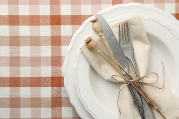Stylish setting with cutlery and plates on table, top view. Space for text