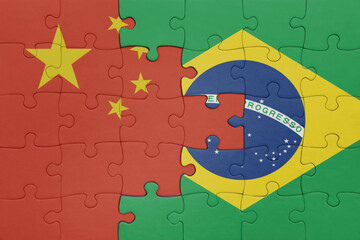 puzzle with the colourful national flag of brazil and flag of china .