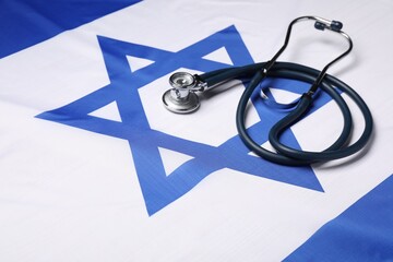 Stethoscope on flag of Israel. Health care concept