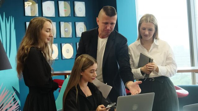 Businessman tells to colleagues about different ideas for future projects in office corporation. Workers analyze project in office