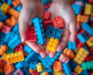 Closeup of child s hands playing with colorful building blocks, highlighting creativity and playfulness Ideal for educational and childhood themes Isolated with ample copy space