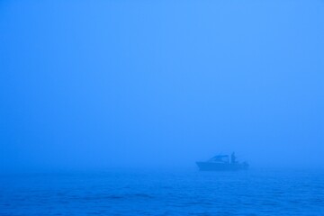 Fisherman In Fog