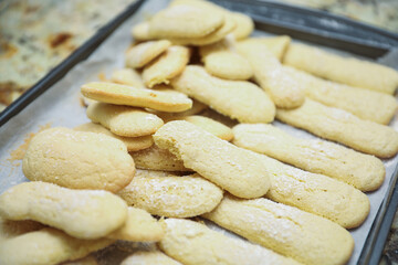 hands delicately layering ingredients to create a luscious tiramisu, showcasing the artistry of homemade desserts