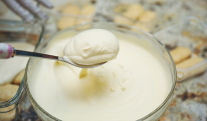 hands delicately layering ingredients to create a luscious tiramisu, showcasing the artistry of homemade desserts