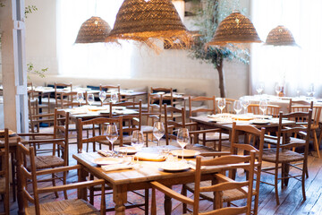 modern restaurant interior with wooden tables and chairs