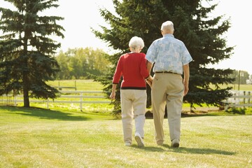 Fototapeta premium Senior Couple Walking Hand In Hand