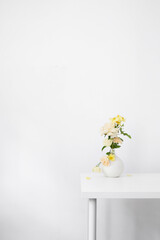 beautiful bouquet in white vase in white interior
