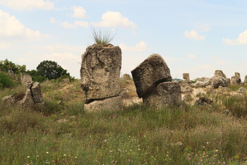 Two of the stone pillars at the Pobiti Kamani Stone Forest, one of them in the shape of a head,...