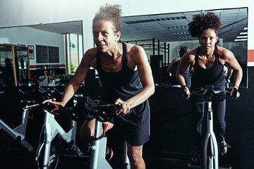 Exercise bike, cardio or women in gym, fitness and energy with cycling, sports or challenge....