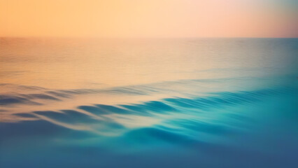 Fototapeta premium Water backdrop of smooth ocean waves in turquoise blue with glowing golden orange sky. Calm and relaxing atmosphere. Calming but colorful to lift the mood.