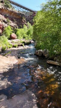 Beautiful  Elevated Vertical Ratio View Of Flowing Oak Creek In Sedona Arizona