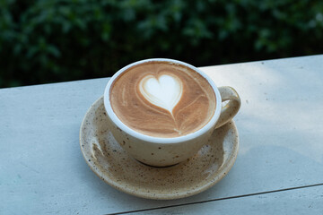 Close up hot coffee with latte art.