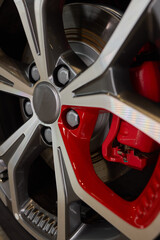 Detailed shot of a sleek black and silver alloy wheel on a motor vehicle