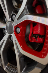 Detailed shot of a sleek black and silver alloy wheel on a motor vehicle