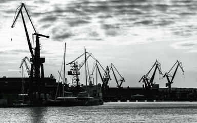 Cranes of the Gdansk shipyard in black and white, Baltic coast