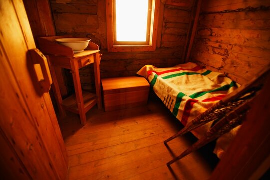 Old-Fashioned Room With Hudson's Bay Company Blanket, Snowshoes And Washing Basin