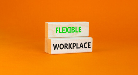 Flexible workplace symbol. Concept words Flexible workplace on beautiful wooden block. Beautiful orange paper background. Business Flexible workplace concept. Copy space.