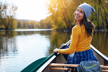 Woman, back and canoeing for water portrait in nature, wellness hobby and single blade paddle for...
