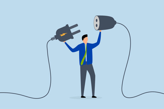 Business continuity, business manager plugs in a power cord to continue business.