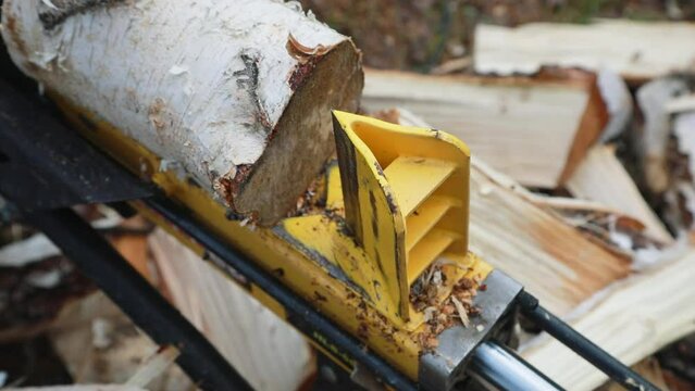 Chopping firewood with an electric wood chipper