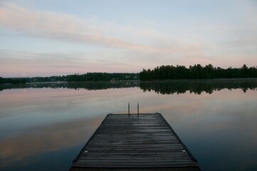 Obraz premium Lake Of The Woods, Ontario, Canada; Pier Leading To Lake
