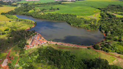 Lake surrounded by vegetation. Aerial view of the municipal Ecological Park of Fox in the city of Apucarana.