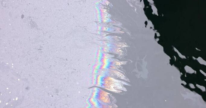 Slick industry oil fuel spilling water pollution closeup