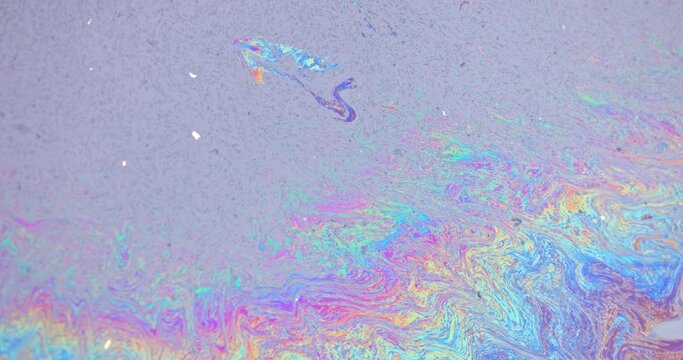 Slick industry oil fuel spilling water pollution closeup