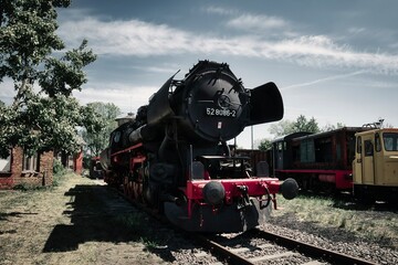 Obraz premium Alte Lokomotive - Alte Dampflok - Old Steam Locomotive - Vintage - Train - Countryside - Railway - Railroad