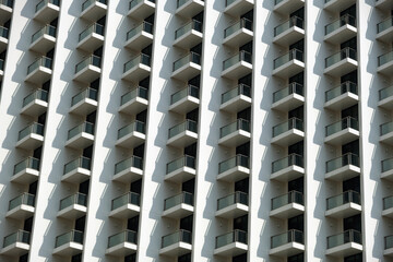 facade of a white building with balconies