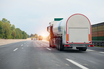 Petrol truck on highway hauling fossil oil refinery products. Fuel delivery transportation....