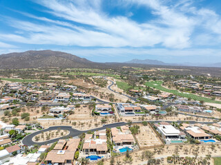 Fototapeta premium Aerial view of luxury golf course on the pacific ocean in Los Cabos, Cabo San Jose, Mexico