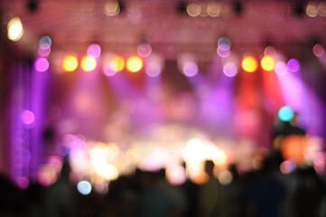 Defocused entertainment show lighting. Out of focus concert stage with bright spotlights with bokeh...