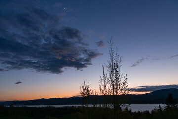 Blue hour dusk spring view of the St. Lawrence River and south shore from the Island of Orleans,...