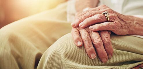 Closeup, morning and hands of senior woman in retirement home for thinking, reflection and...