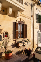 A construction lone ground floor window in Malta