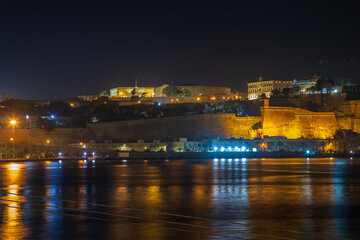 Cospicua, Malta at night as seen from a ship in dry dock