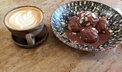 restaurant menu, cafe menu, chocolate profiteroles and latte coffee isolated on wood