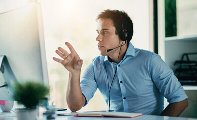 Customer service, phone call and man with headset, computer and consulting at help desk. Lead...