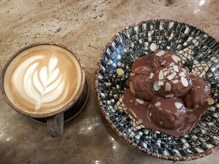 restaurant menu, cafe menu, chocolate profiteroles and latte coffee isolated on wood