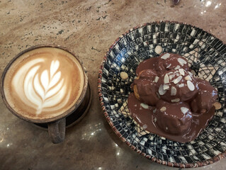 restaurant menu, cafe menu, chocolate profiteroles and latte coffee isolated on wood