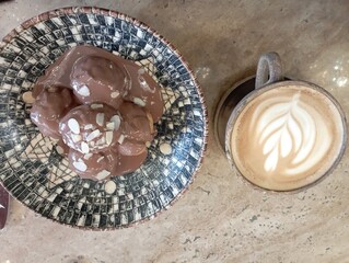restaurant menu, cafe menu, chocolate profiteroles and latte coffee isolated on wood
