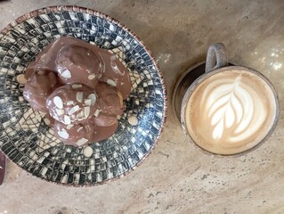 restaurant menu, cafe menu, chocolate profiteroles and latte coffee isolated on wood