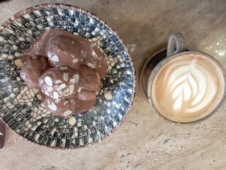 restaurant menu, cafe menu, chocolate profiteroles and latte coffee isolated on wood