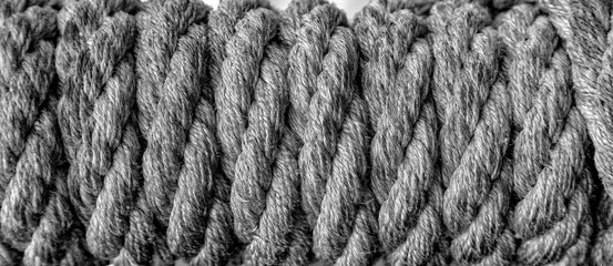 reeled rope on the coil. The texture of a rope. Thick rope rolled into a roll. Background texture
