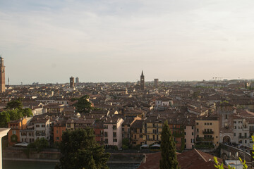 Obraz premium Sunset over the town in Verona, Veneto region, Italy. Beautiful view of the Italian city from above. Tourist places, travelling 