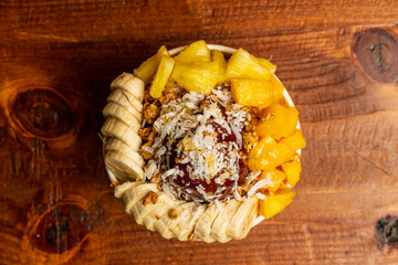 Acai bowl with bananas, mango and pineapple