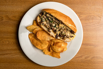Cheesesteak sandwich with potato chips